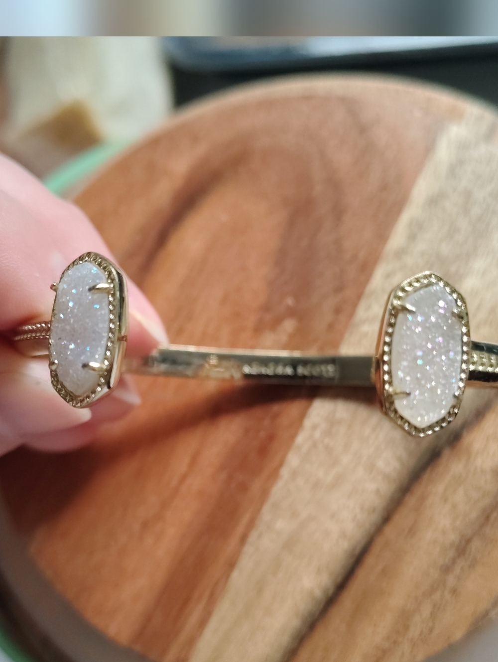 Kendra Scott Elton gold cuff bracelet featuring iridescent drusy stones.